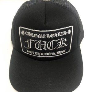 The white Chrome Hearts logo is embroidered on a black baseball cap